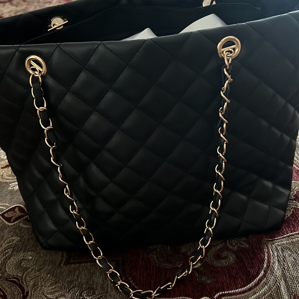 Black quilted bag with chain strap